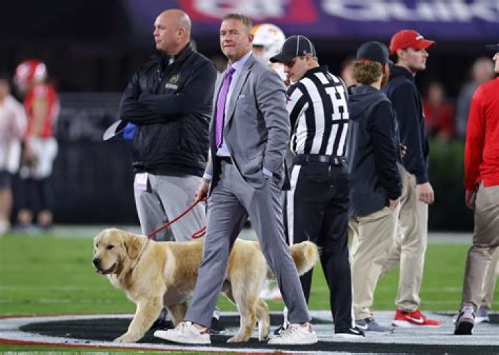 Why Does Kirk Herbstreit Travel With His Beloved Canine Companion?